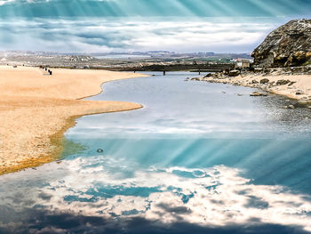 Scenic view of beach against sky