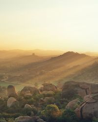 Scenic view of landscape against sky during sunset