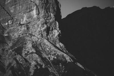 Low angle view of rock formation against sky