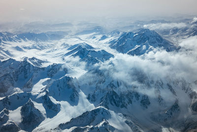 Scenic view of snowcapped mountains against sky