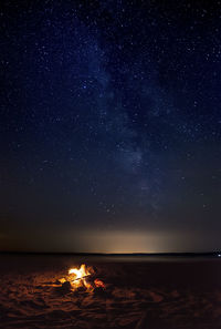 Scenic view of sea against sky at night