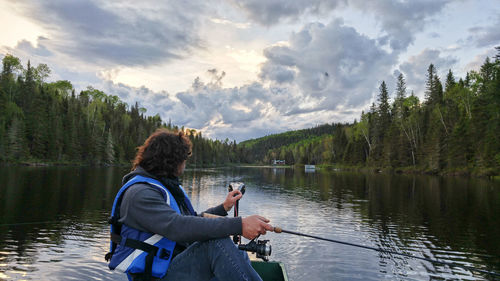 Man fishing in lake