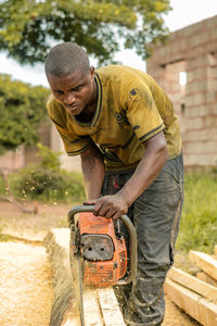 Side view of man working at park