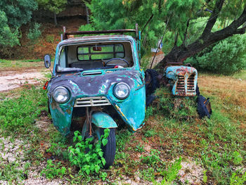 Abandoned vehicles on field