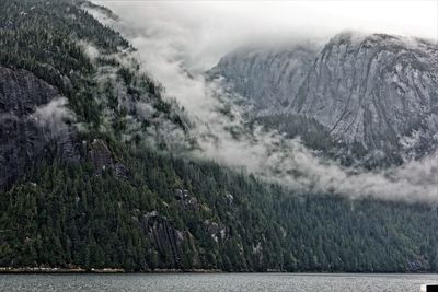 Scenic view of mountains during foggy weather