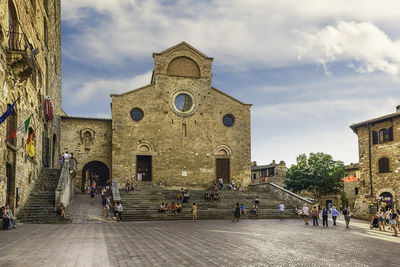 Group of people in front of historic building