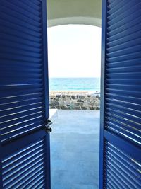 Scenic view of sea against sky seen through window