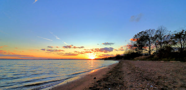 Scenic view of sea against sky during sunset