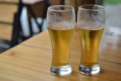 Close-up of beer glass on table