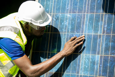 Engineer installing solar panel