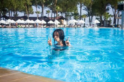 Young woman swimming in pool