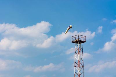 Low angle view of communications tower against sky