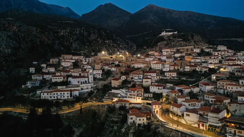 High angle shot of townscape against sky at night