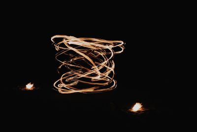 Close-up of light painting against black background