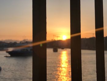 Close-up of sea against sky during sunset