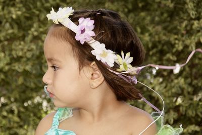 Close-up of cute girl wearing flowers