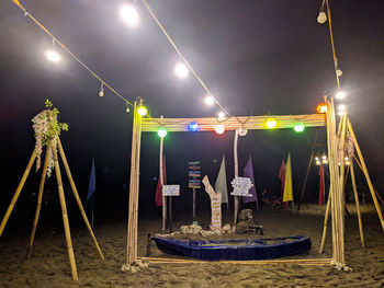 Panoramic shot of illuminated lights in sea at night