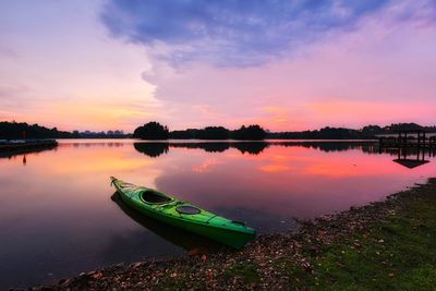 Scenic view of calm lake at sunset