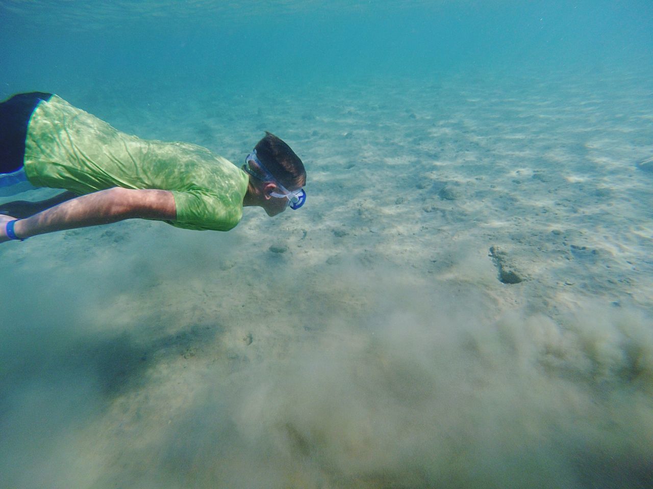 lifestyles, water, leisure activity, men, unrecognizable person, blue, high angle view, sea, swimming, underwater, holding, adventure, part of, low section, shoe, day, nature