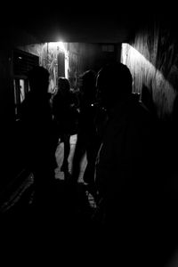 Man standing in illuminated room