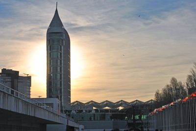 Low angle view of buildings against sky during sunset
