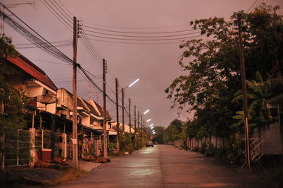 Street amidst buildings against sky