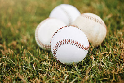 Close-up of baseball on grass