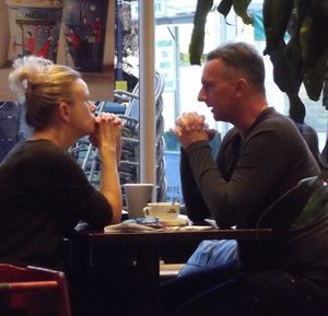 Friends sitting on table at restaurant