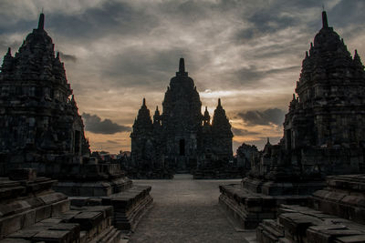 Statue of temple against cloudy sky