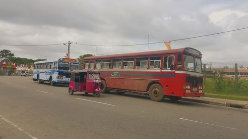 Cars on road against sky