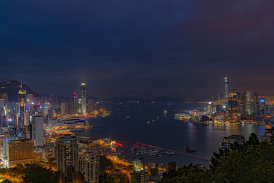 High angle view of illuminated buildings in city at night