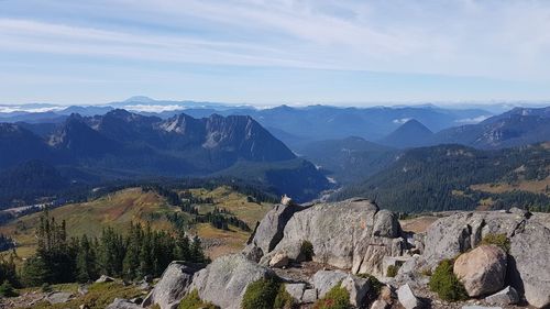 Marmot enjoys the spectacular view in mount rainier np - scenic view of mountains against sky