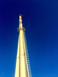 Low angle view of building against clear blue sky