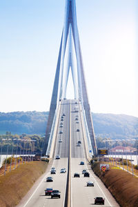 View of bridge in city against clear sky