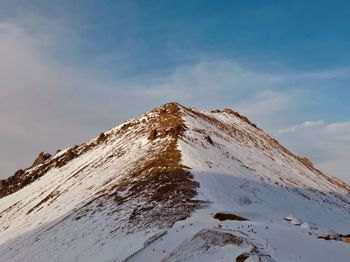 Scenic view of snowcapped mountain against sky