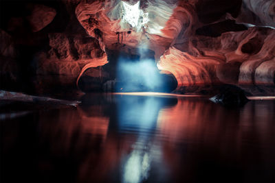 Reflection of rock formation in lake