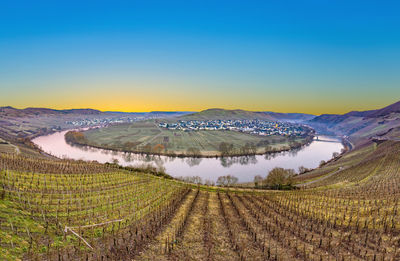 Scenic view of landscape against clear blue sky