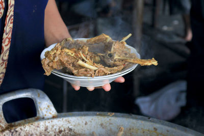 Close-up of person preparing food