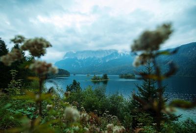 Scenic view of lake and mountains against sky