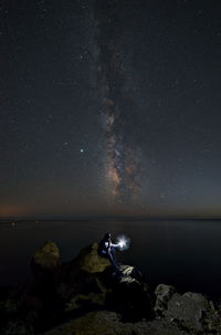 Scenic view of sea against sky at night