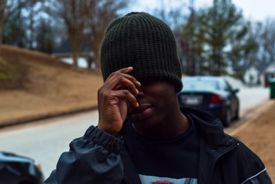 Close-up of man wearing knit hat