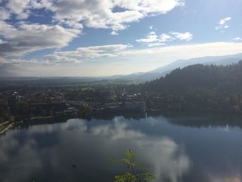 Scenic view of lake and mountains against sky