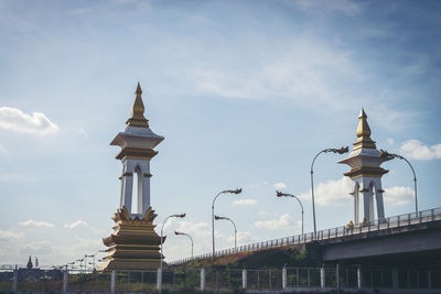 Low angle view of building against cloudy sky