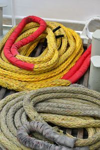 High angle view of ropes tied up on wicker basket