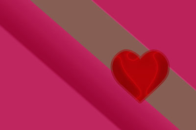 Close-up of heart shape on pink paper