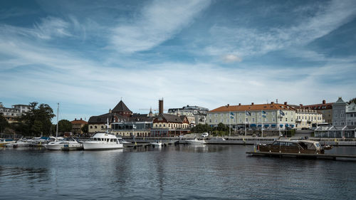 Boats in harbor in city