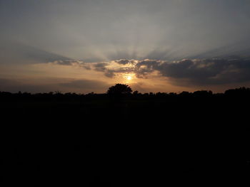 Silhouette landscape against sky during sunset