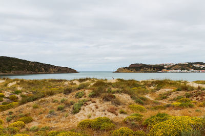 Scenic view of beach lagoon against sky