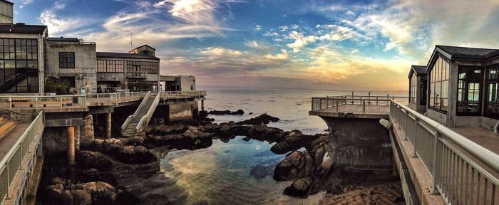 Exterior of monterey bay aquarium overlooking ocean at sunset