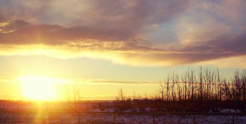 Silhouette landscape against sky during sunset